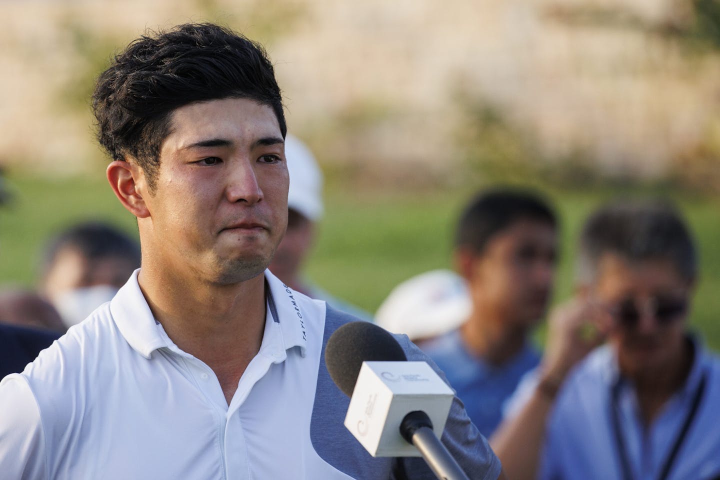 Keita Nakajima of Japan holds back tears as he gives a speech after winning the 2021 Asia-Pacific Amateur Championship
