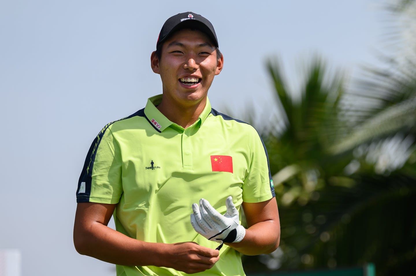 Bo Jin of China smiles on the 1st tee on Round 3