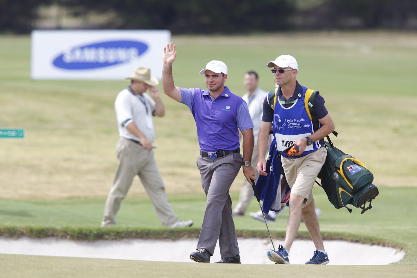 Melbourne, Australia: 2014 Asia-Pacific Amateur champion Antonio Murdaca of Australia acknowledges the applause on the 18th hole the Asia-Pacific Amateur Championship at the Royal Melbourne Golf Club). October 26 2014, (photo by Dave Tease/AAC)