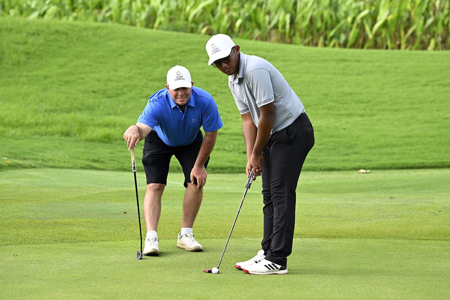 Teaching professional Scott Barr pictured with Hariz Hezri of Malaysia at the AAC Golf Academy on Monday September 5, 2022, at Amata Spring Country Club, Chonburi, Thailand