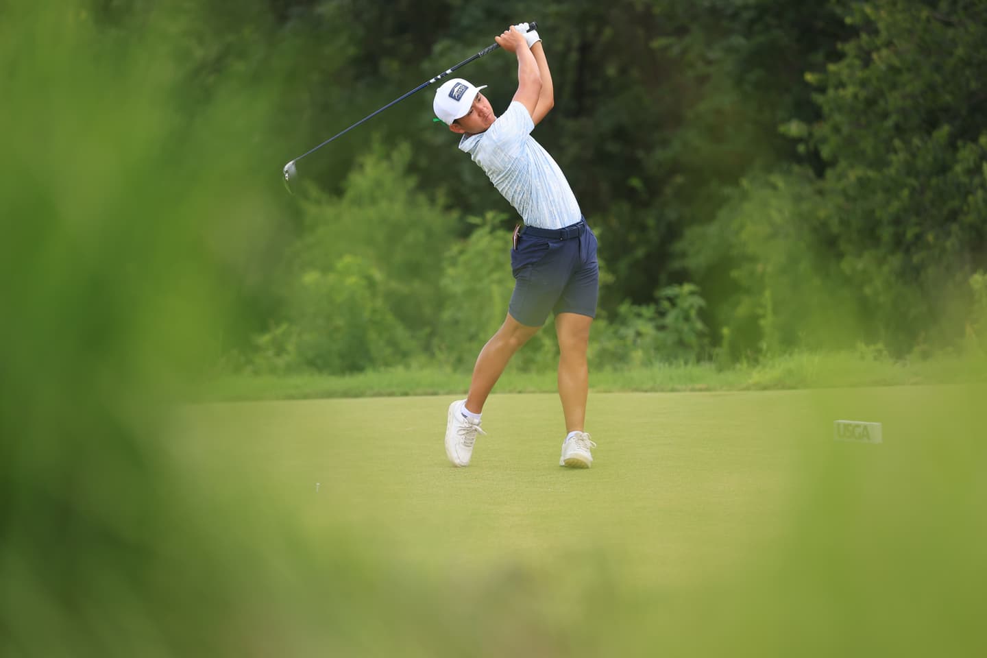 Anh Minh Nguyen tees off on the 24th hole during the finals of the 2025 U.S. Junior Amateur at Trinity Forest Golf Club